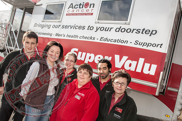 McCabe's Shop Newotwnbutler celebrating 10 years in business withbit Red Cancer Bus.