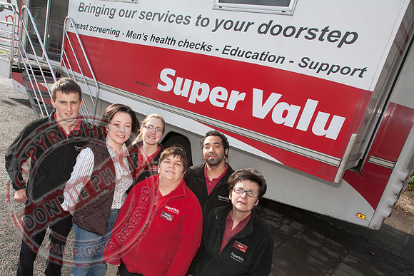 McCabe's Shop Newotwnbutler celebrating 10 years in business withbit Red Cancer Bus.