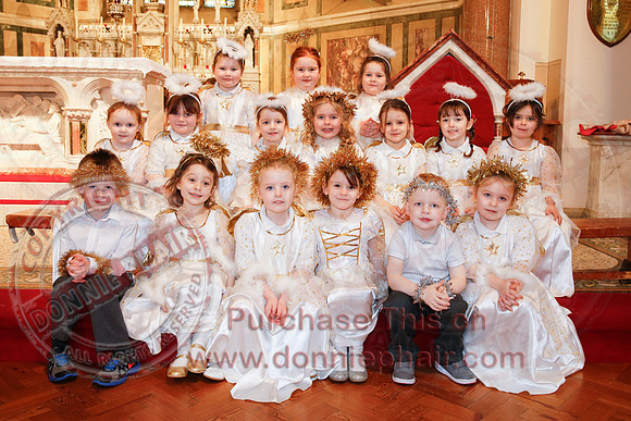 St. Ronan's Primary School performing Chirstmas Carols in The Holy Cross Church, Lisnaskea.