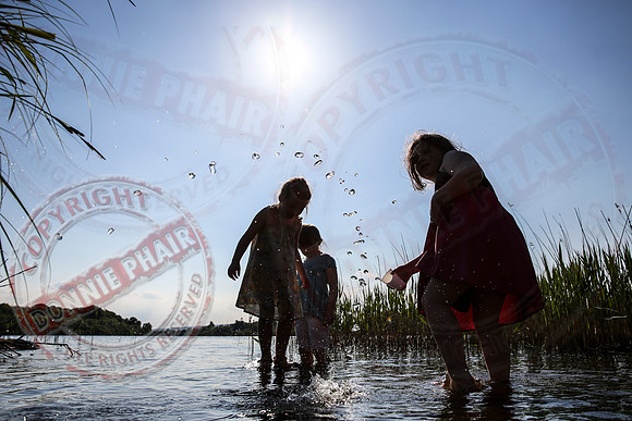 Children playing in Upper Lough Erne at Crom Estate.
