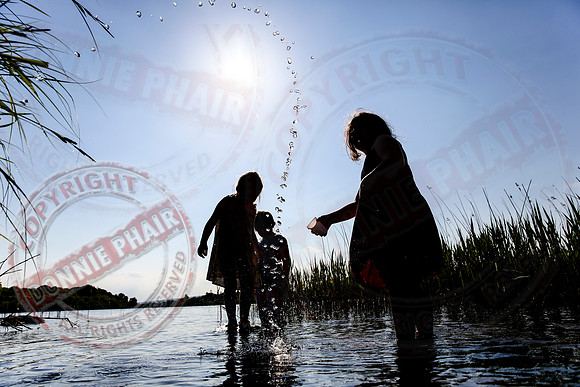Children playing in Upper Lough Erne at Crom Estate.