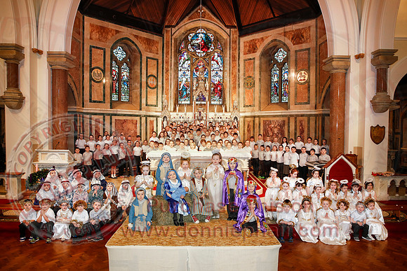 St. Ronan's Primary School performing Chirstmas Carols in The Holy Cross Church, Lisnaskea.