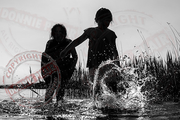 Children playing in Upper Lough Erne at Crom Estate.