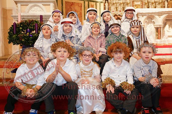 St. Ronan's Primary School performing Chirstmas Carols in The Holy Cross Church, Lisnaskea.