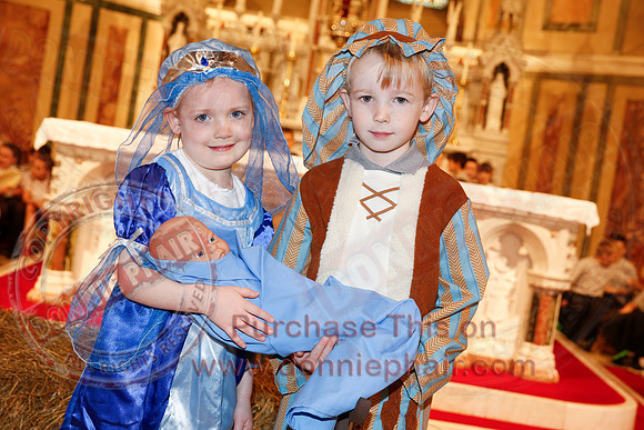 St. Ronan's Primary School performing Chirstmas Carols in The Holy Cross Church, Lisnaskea.