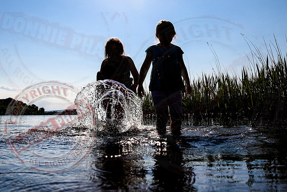 Children playing in Upper Lough Erne at Crom Estate.