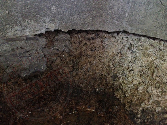 Sump in neighbours' garden that's not benched or made watertight.