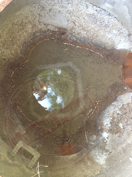 Sump in neighbours' garden that's not benched or made watertight.