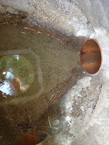 Sump in neighbours' garden that's not benched or made watertight.