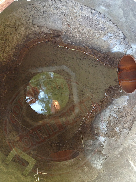 Sump in neighbours' garden that's not benched or made watertight.