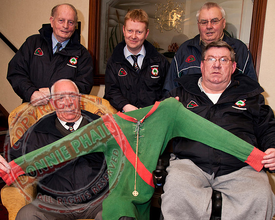 Lisnaskea Club members hold 1929 Lisnaskea Jersey.
